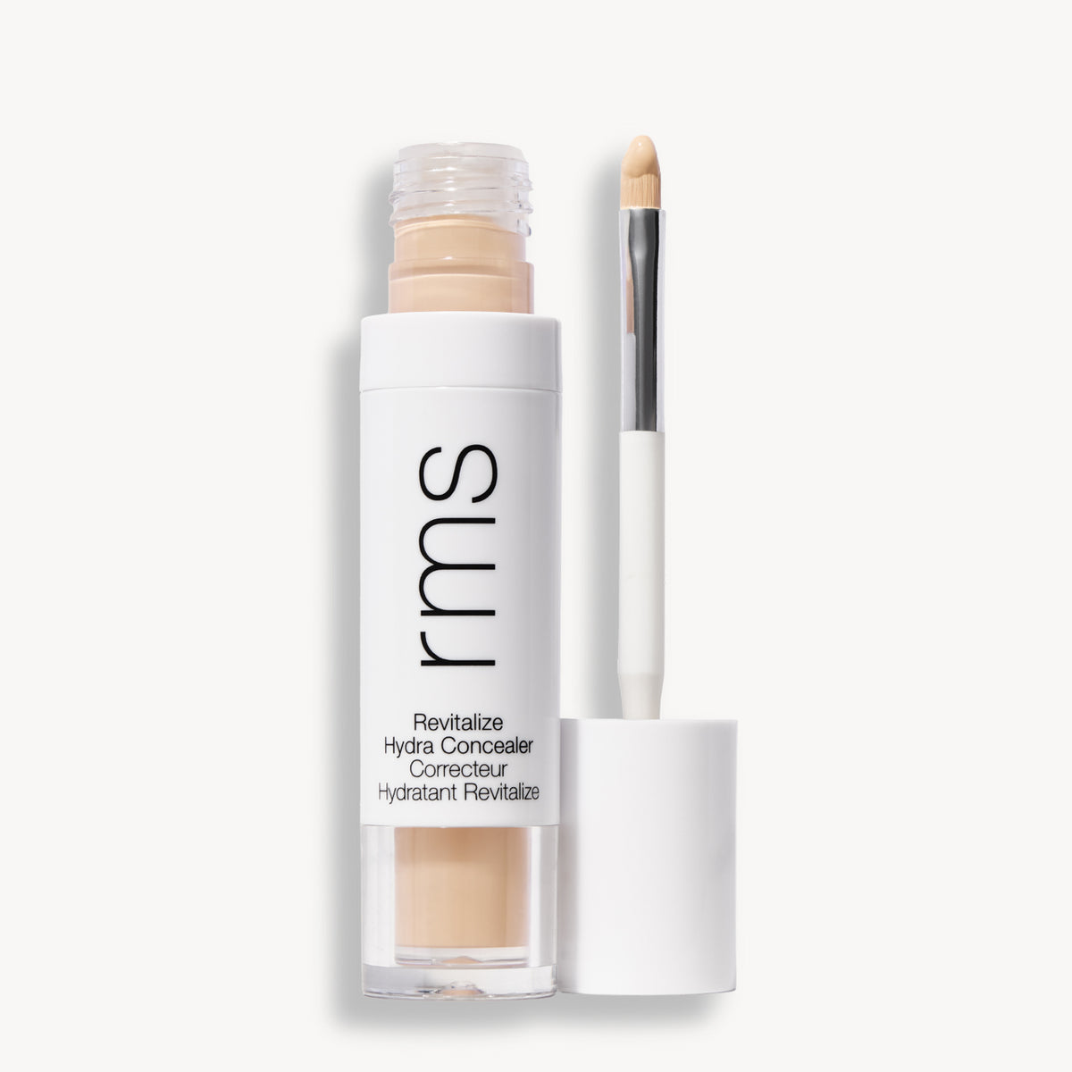 Flacon et applicateur du RMS Beauty Revitalize Hydra Concealer, Teinte CN03. Anti-cernes liquide revitalisant pour une couvrance moyenne naturelle et lumineuse.