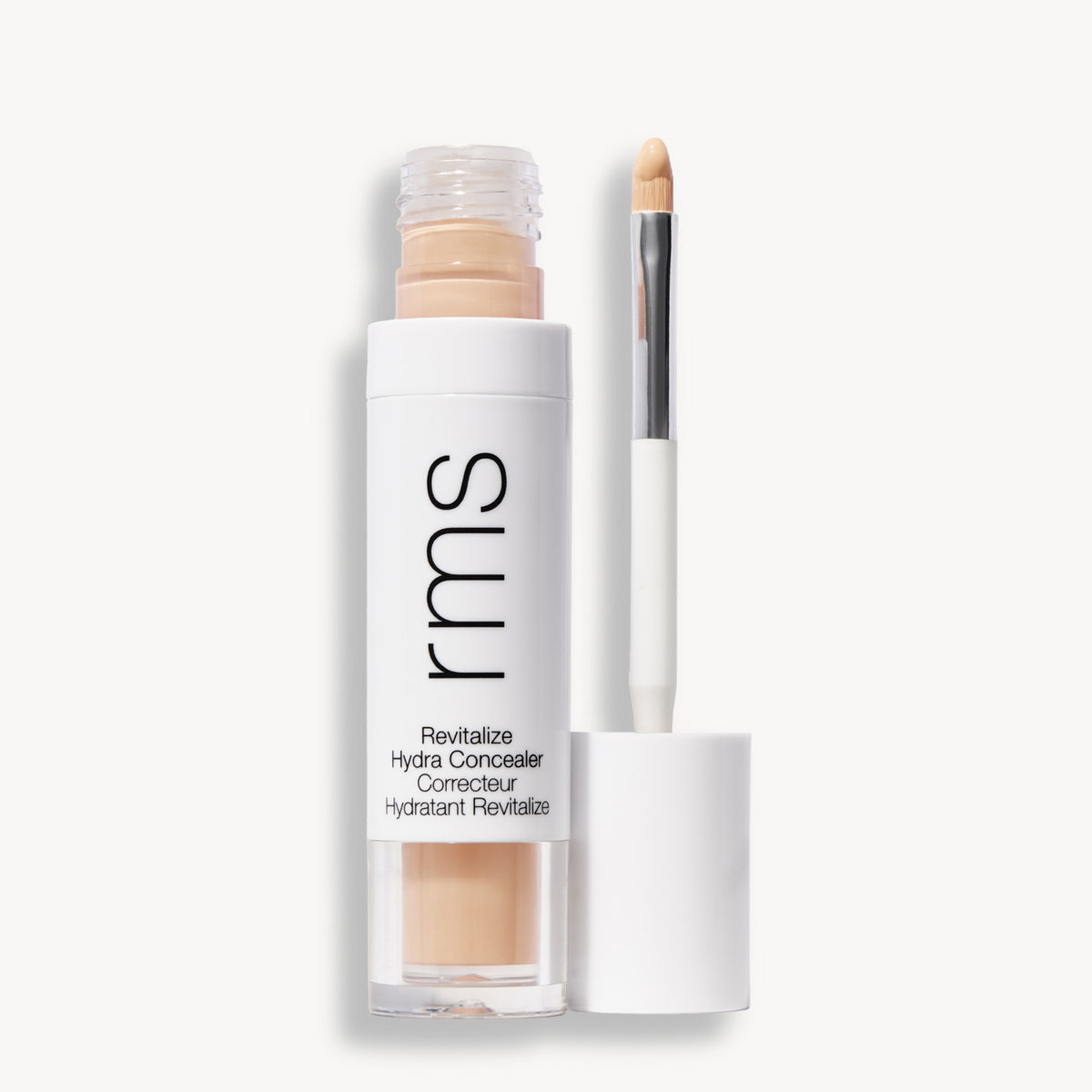 Flacon et applicateur du RMS Beauty Revitalize Hydra Concealer, Teinte C06. Anti-cernes liquide revitalisant pour une couvrance moyenne naturelle et lumineuse.