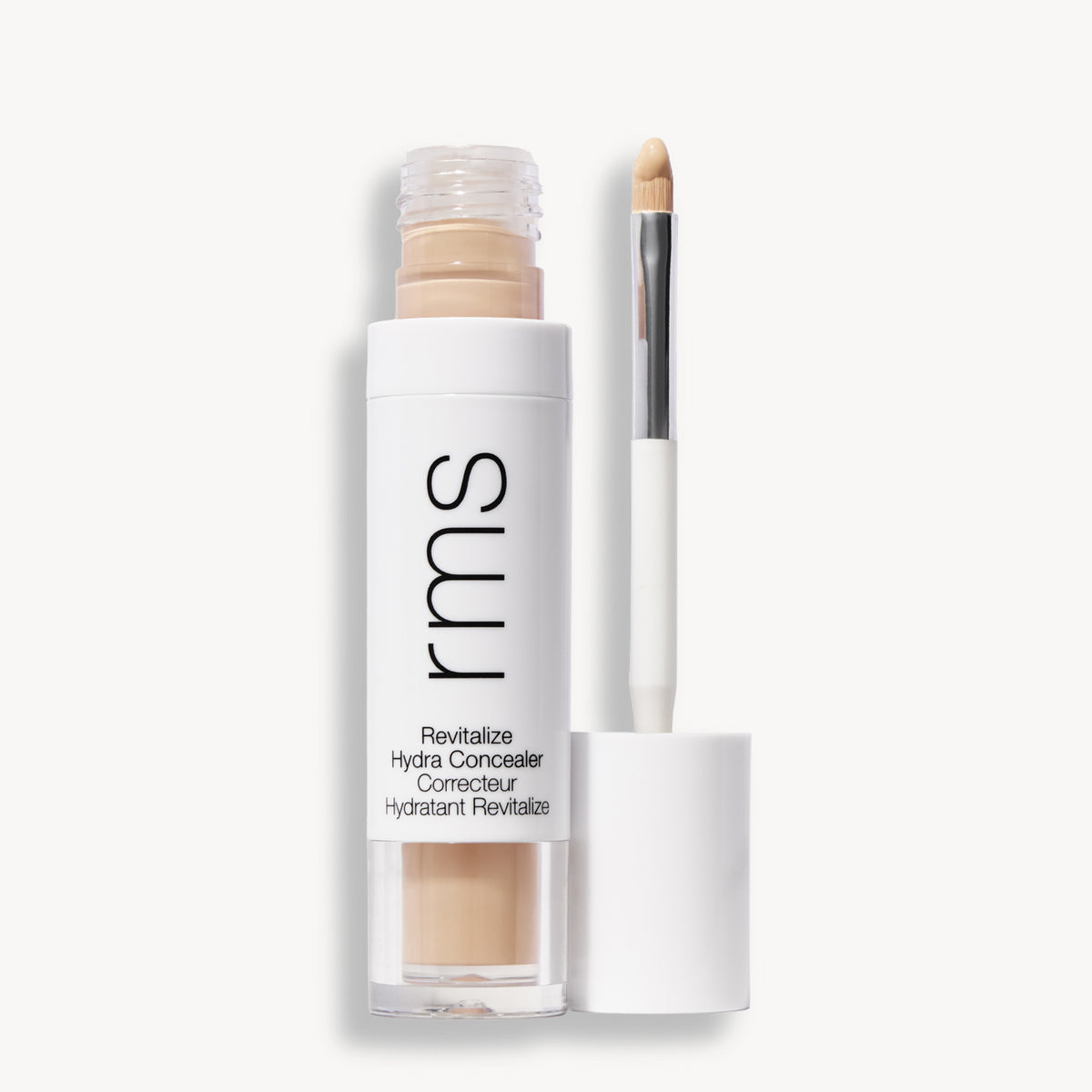 Flacon et applicateur du RMS Beauty Revitalize Hydra Concealer, Teinte CN07. Anti-cernes liquide revitalisant pour une couvrance moyenne naturelle et lumineuse.