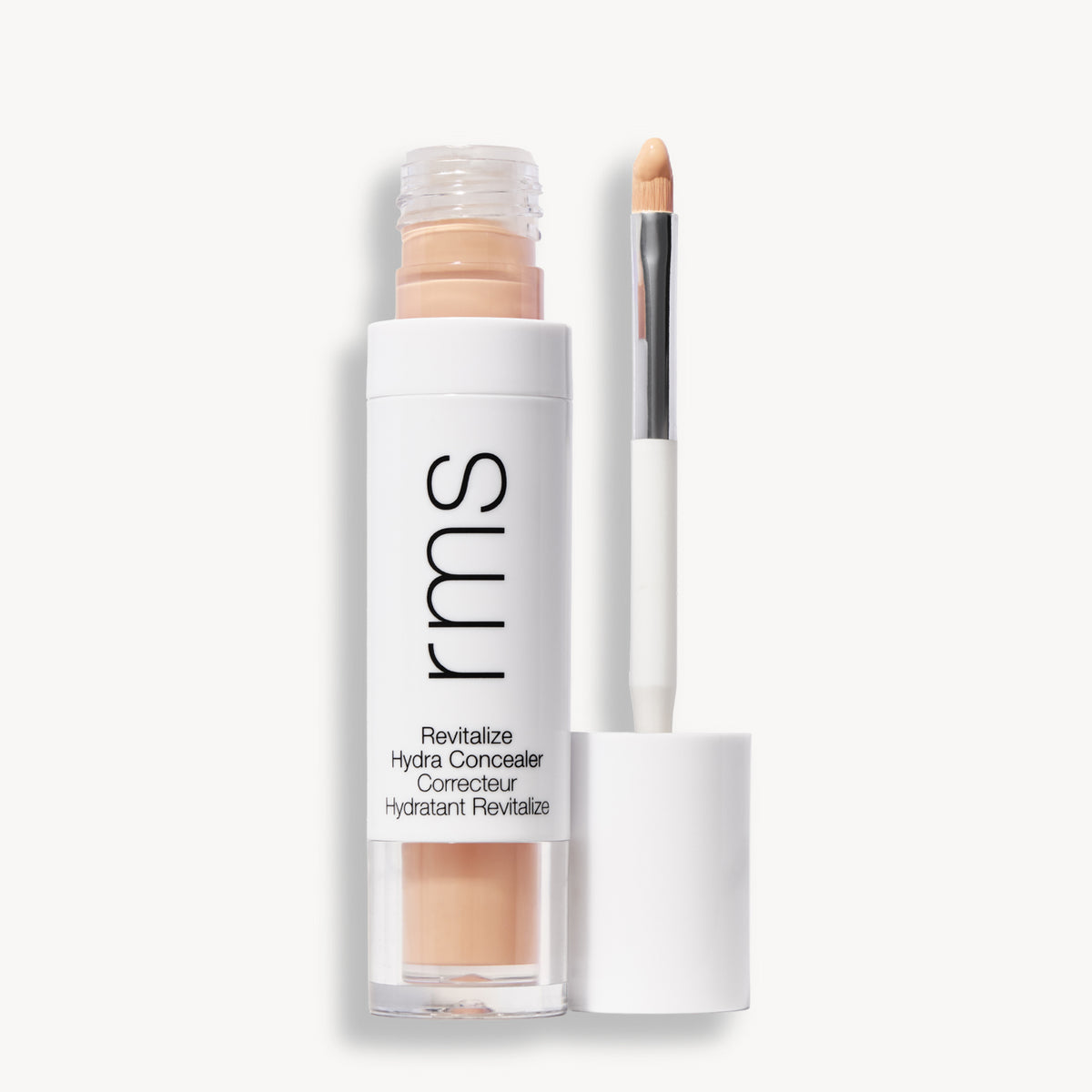 Flacon et applicateur du RMS Beauty Revitalize Hydra Concealer, Teinte CN010. Anti-cernes liquide revitalisant pour une couvrance moyenne naturelle et lumineuse.