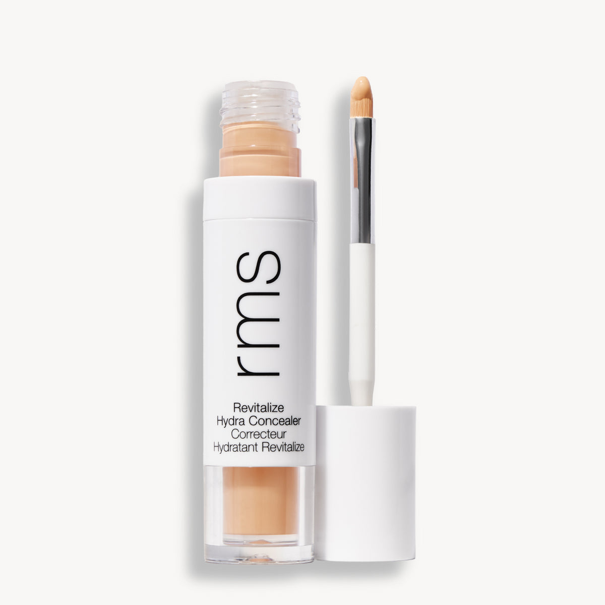 Flacon et applicateur du RMS Beauty Revitalize Hydra Concealer, Teinte WN011. Anti-cernes liquide revitalisant pour une couvrance moyenne naturelle et lumineuse.