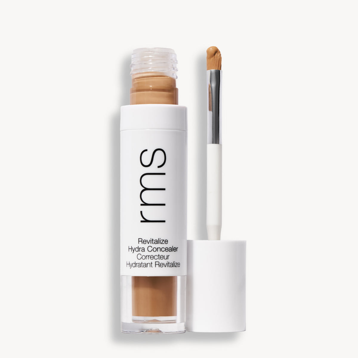 Flacon et applicateur du RMS Beauty Revitalize Hydra Concealer, Teinte CN018. Anti-cernes liquide revitalisant pour une couvrance moyenne naturelle et lumineuse.
