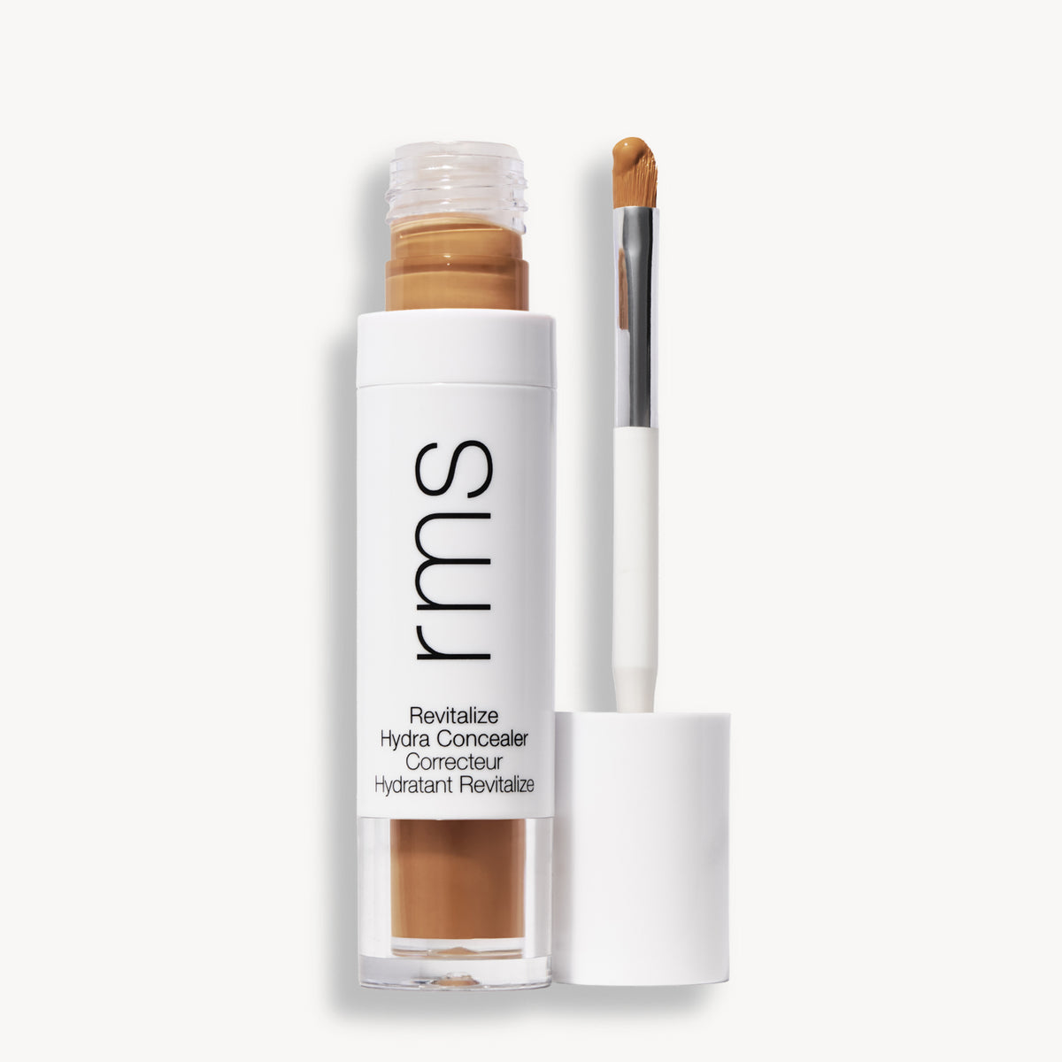 Flacon et applicateur du RMS Beauty Revitalize Hydra Concealer, Teinte W019. Anti-cernes liquide revitalisant pour une couvrance moyenne naturelle et lumineuse.