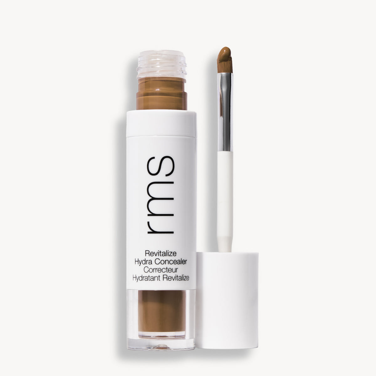Flacon et applicateur du RMS Beauty Revitalize Hydra Concealer, Teinte ON021. Anti-cernes liquide revitalisant pour une couvrance moyenne naturelle et lumineuse.