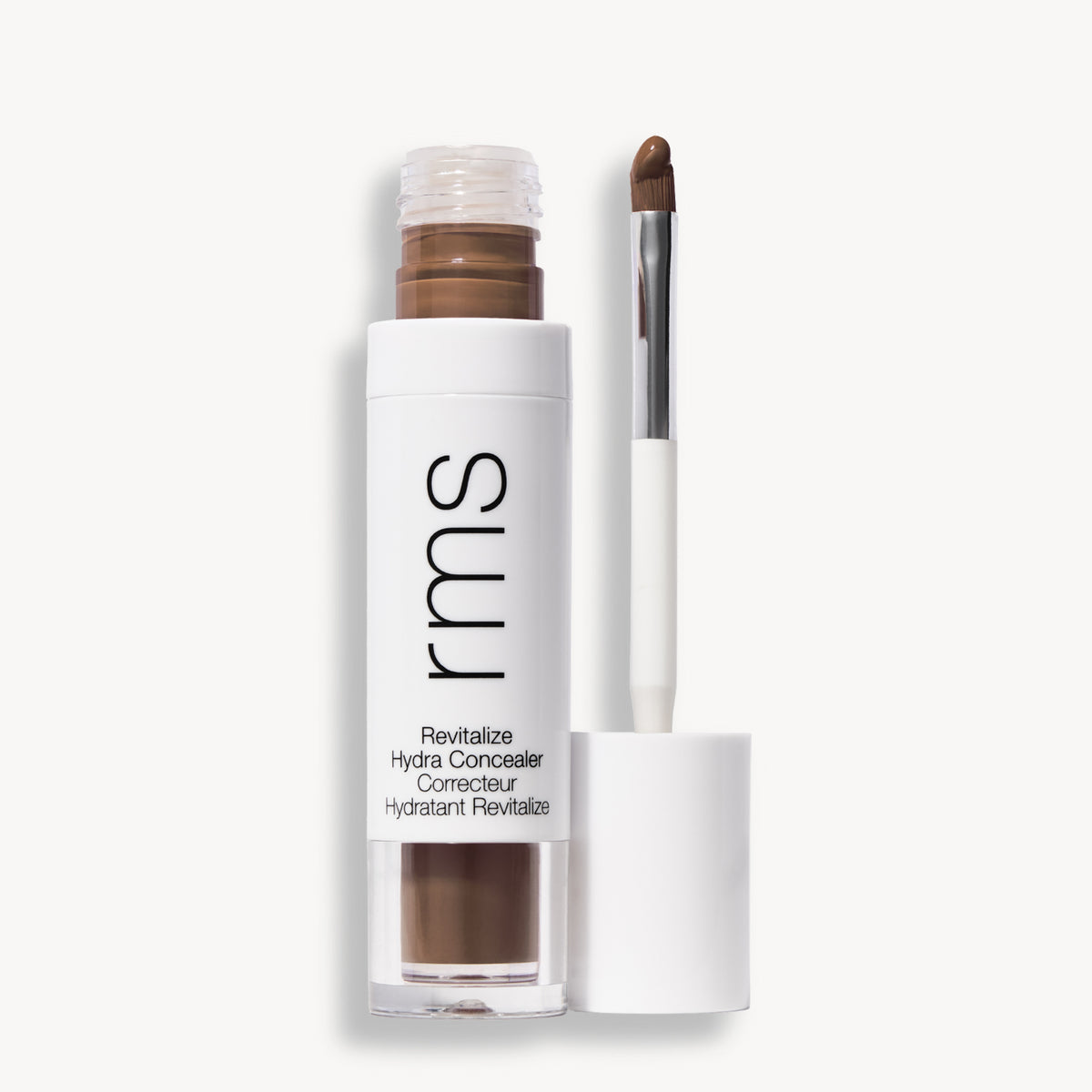 Flacon et applicateur du RMS Beauty Revitalize Hydra Concealer, Teinte WN024. Anti-cernes liquide revitalisant pour une couvrance moyenne naturelle et lumineuse.