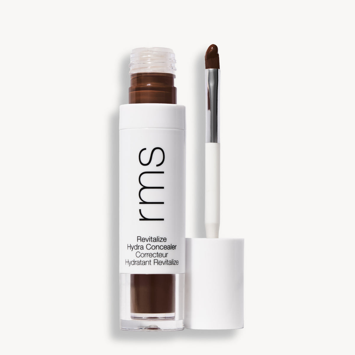Flacon et applicateur du RMS Beauty Revitalize Hydra Concealer, Teinte CN025. Anti-cernes liquide revitalisant pour une couvrance moyenne naturelle et lumineuse.