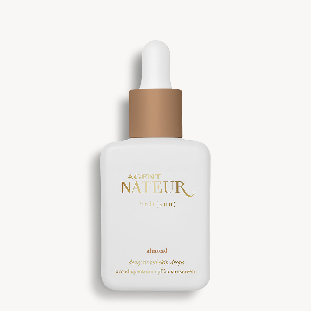 Holi (Sun) Dewy Tinted Skin Drops SPF50 - Agent Nateur - flacon teinte Almond de face