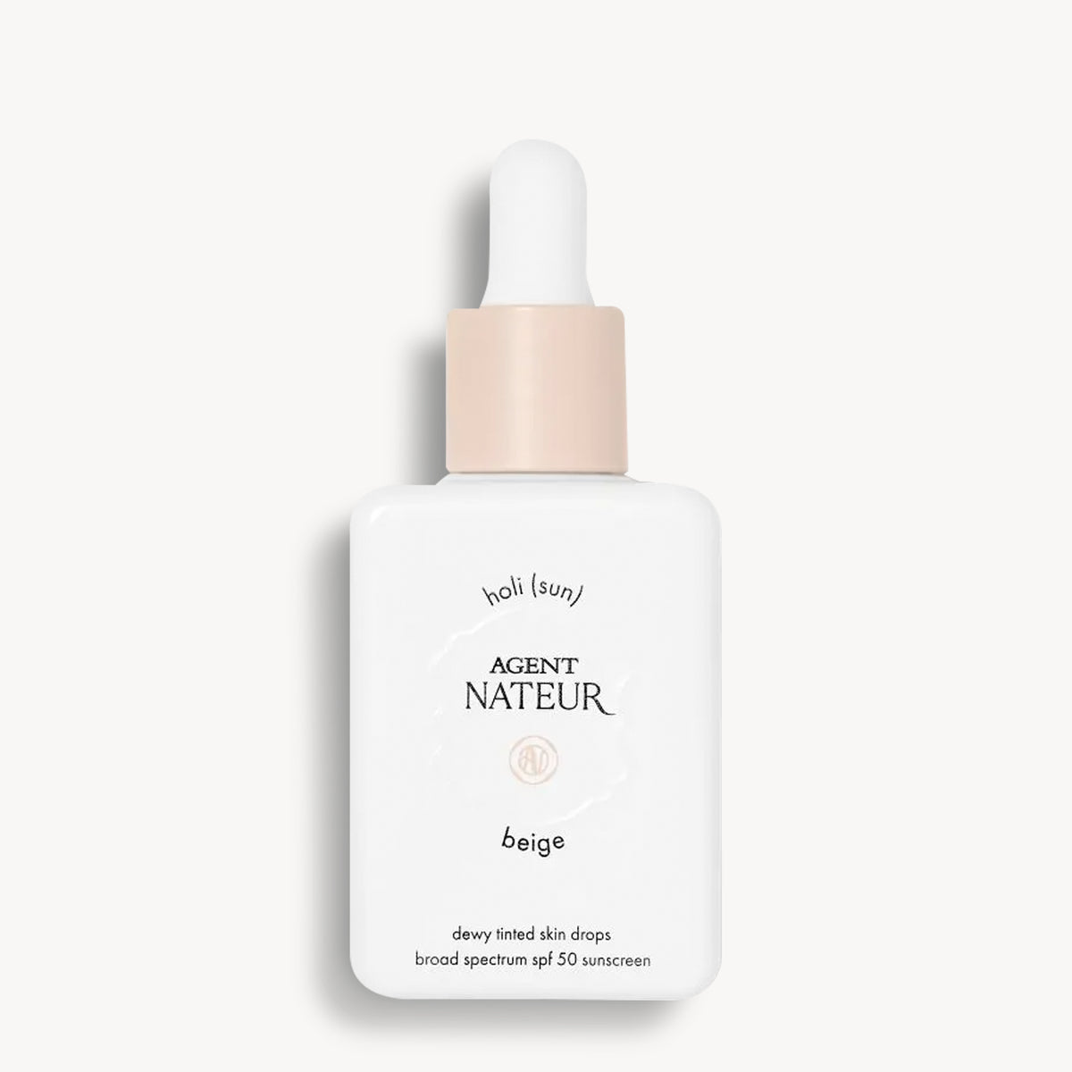 Holi (Sun) Dewy Tinted Skin Drops SPF50 - Agent Nateur - flacon teinte Beige de face
