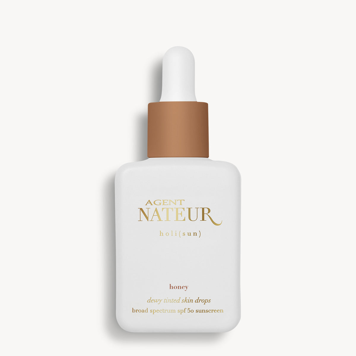 Holi (Sun) Dewy Tinted Skin Drops SPF50 - Agent Nateur - flacon teinte Honey de face