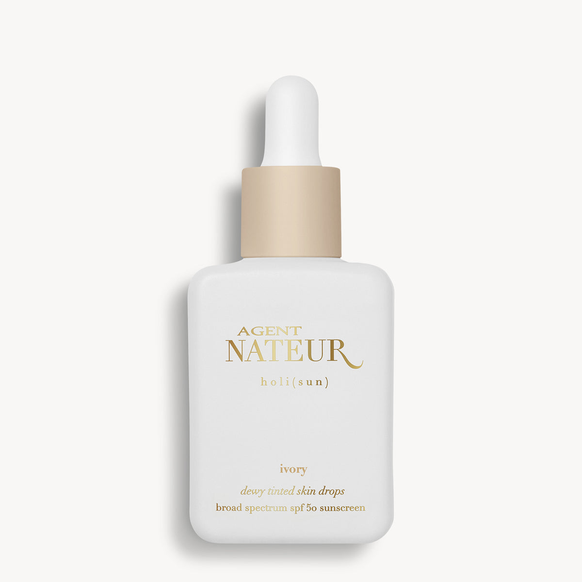 Holi (Sun) Dewy Tinted Skin Drops SPF50 - Agent Nateur - flacon teinte Ivory de face