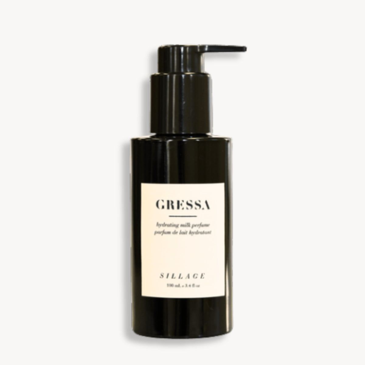 Lait pour le corps Sillage de GRESSA SKIN. Huile parfumée onctueuse et hydratante pour corps et cheveux. Parfum naturel floral. Flacon pompe noir.